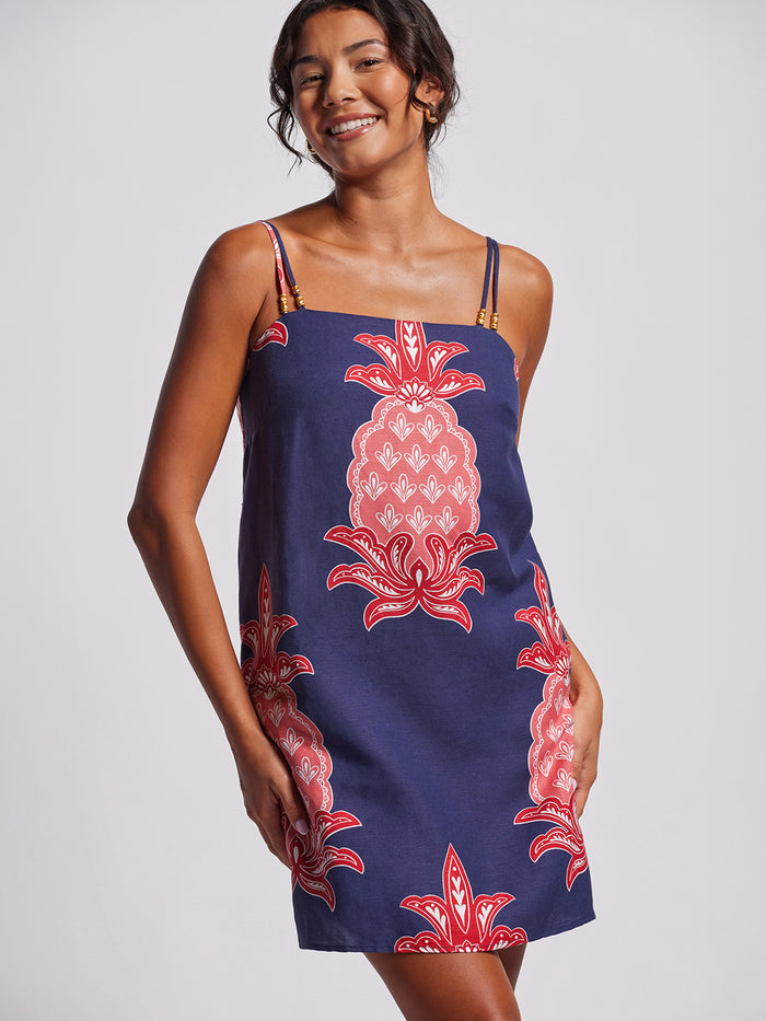 Navy shift dress with pink and red floral print, front view shown in both images.