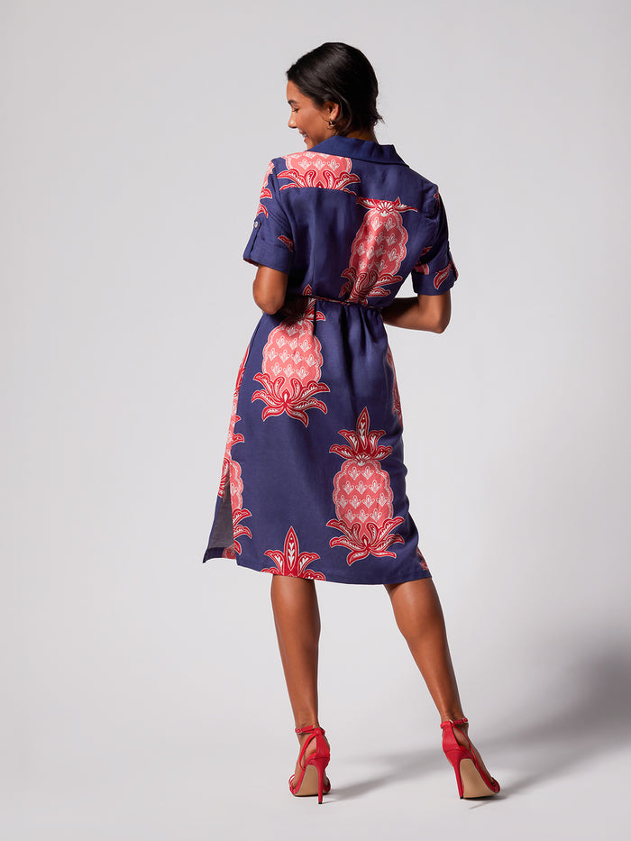 Navy dress with pink pineapple print, double waist tie, linen-viscose blend, rear view.