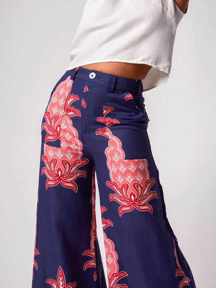 Navy floral linen-viscose wide-leg pants, front view with white sleeveless top.