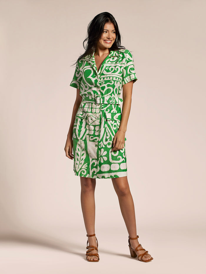 Green tropical-print sleeveless dress with belt, full-length front view on plain background.
