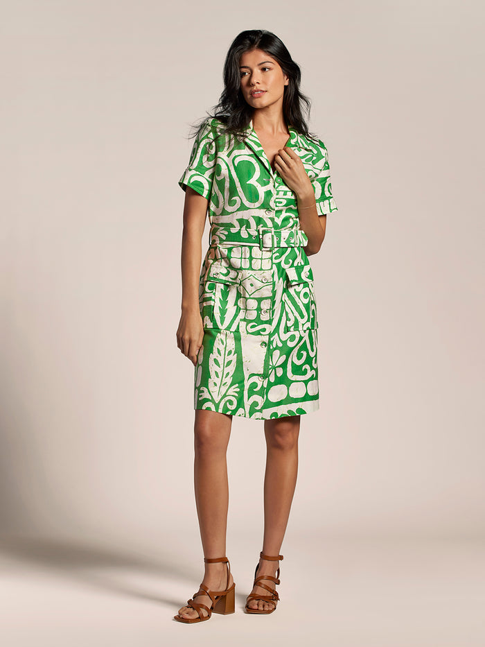 Green Tahitian floral-print Magda dress with belted waist and tan heeled sandals, front view.