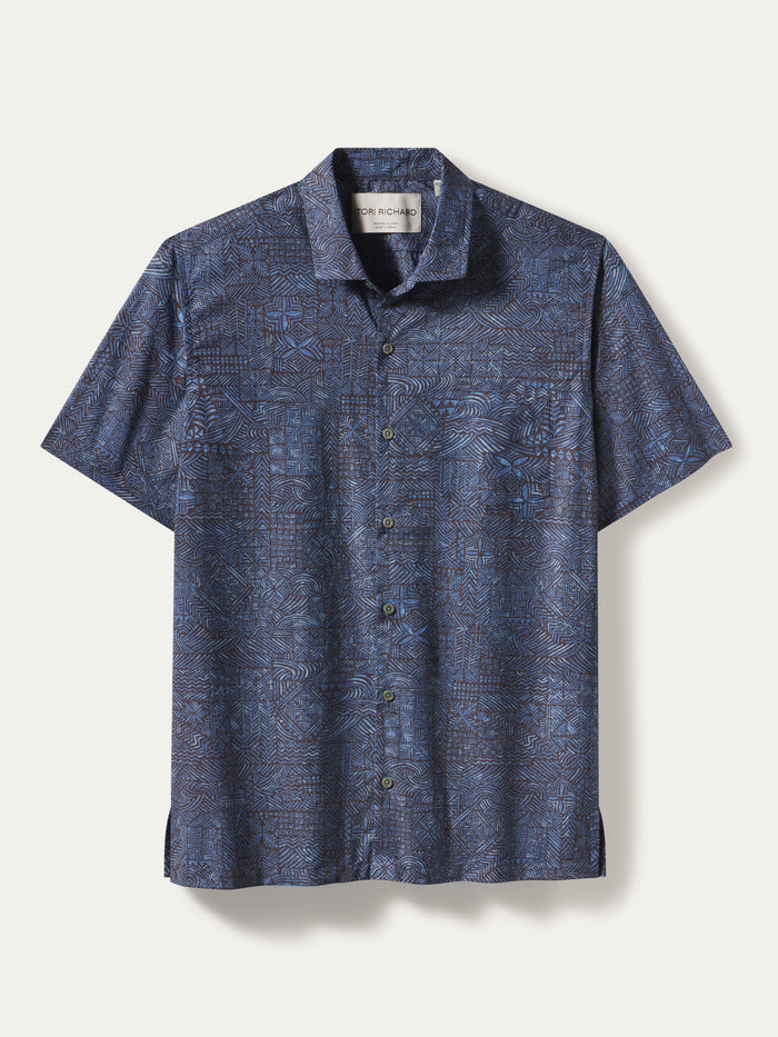Blue geometric-print cotton short-sleeve button-up shirt shown in flat lay view in both images.