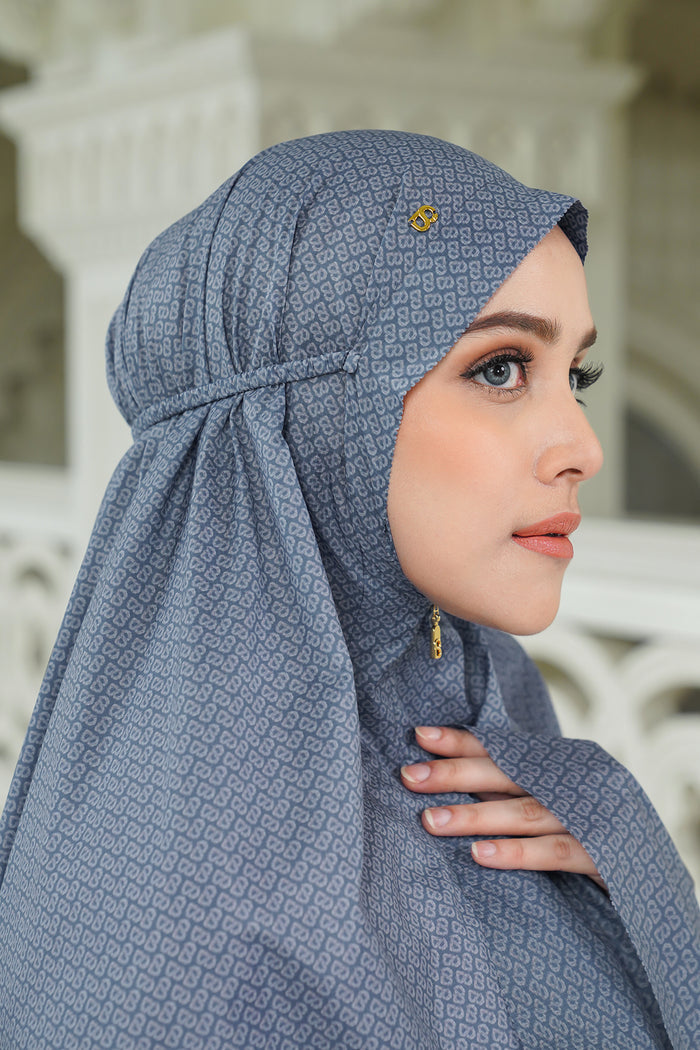 tapis de fleur capsule prayer robe in denim by buttonscarves with zipper under the chin