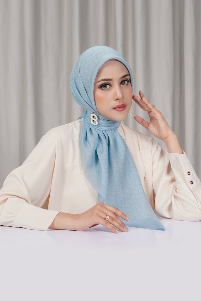 tapis square scarf in baby blue by buttonscarves side view