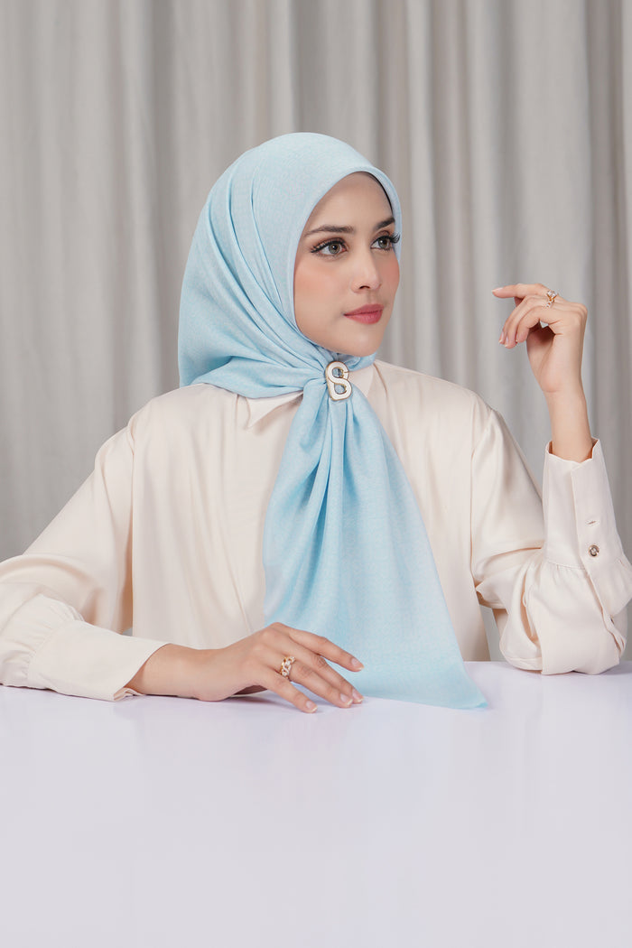 tapis square scarf in delicate blue by buttonscarves side view
