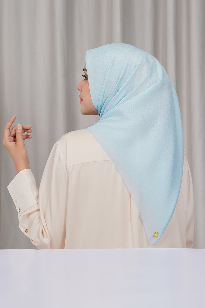 tapis square scarf in delicate blue by buttonscarves back view