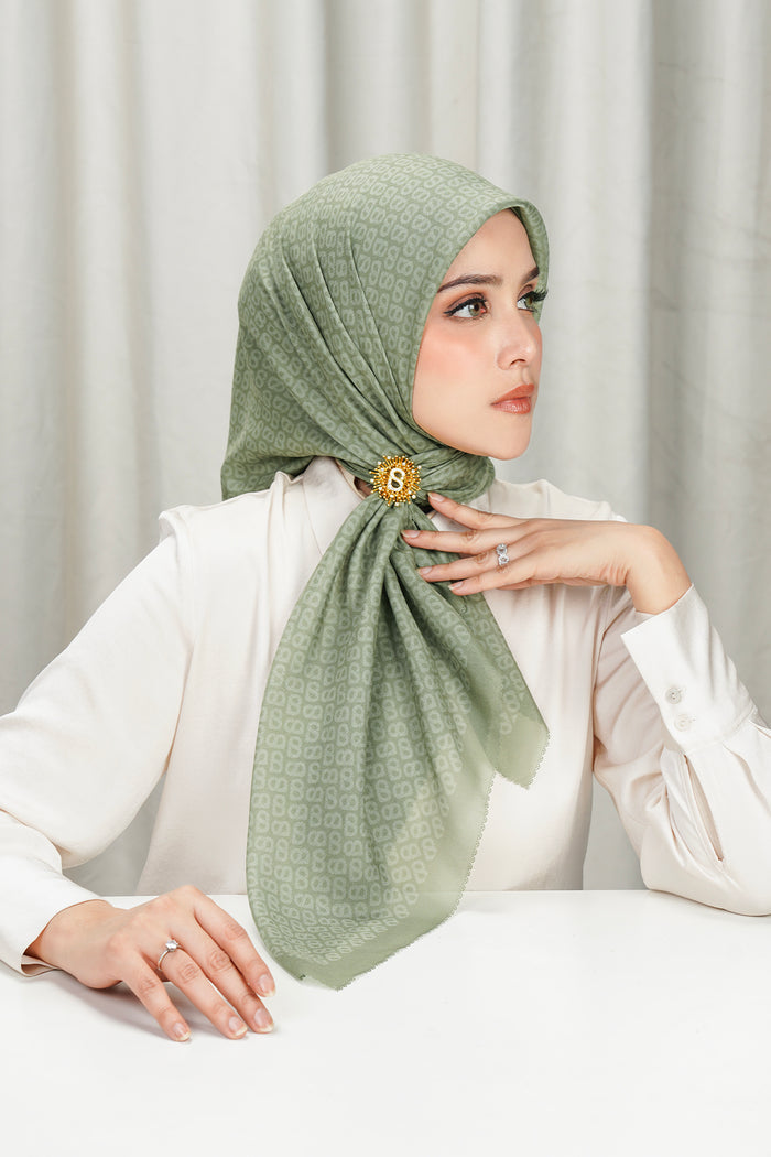 tapis square scarf in sage by buttonscarves side view