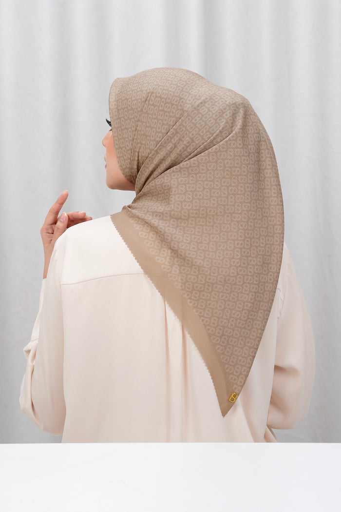 tapis square scarf in sand by buttonscarves back view