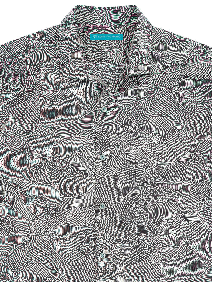 Black and white wave-print cotton shirt with turquoise inner label/tag, front view.