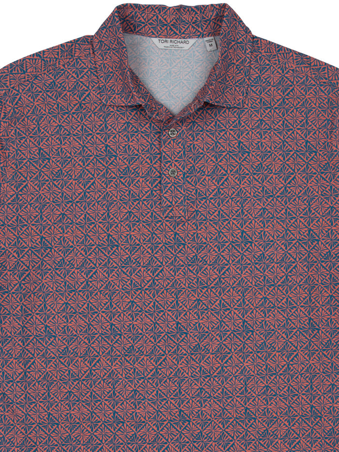 Red/blue geometric polo, collar, moisture wicking. wrinkle resistant, front view.
