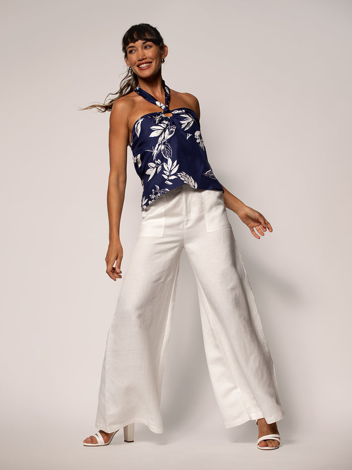White floral-print short-sleeve top and wide-leg pants with heels, front view.