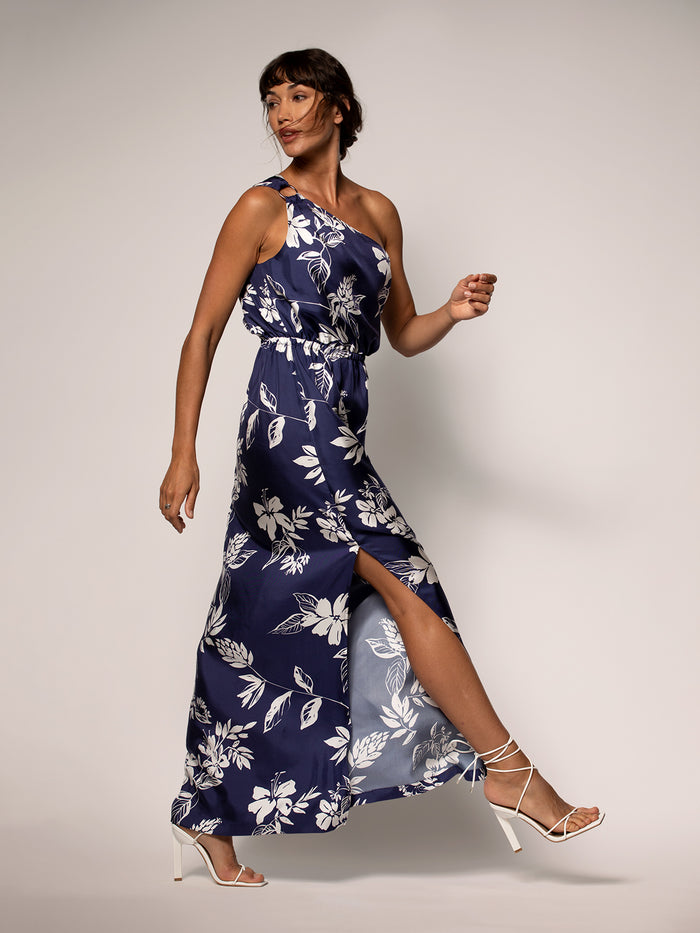 Navy floral one-shoulder maxi dress with white heels, full-length front view.