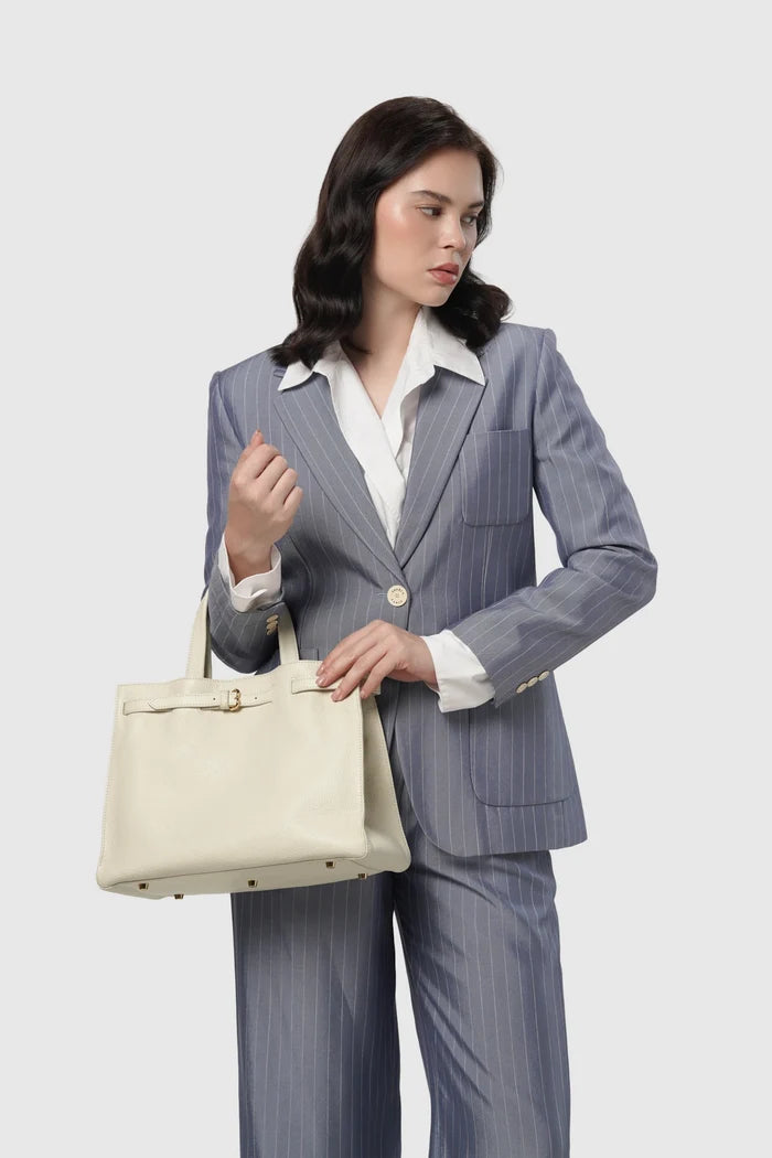 the city bag medium in gardenia by buttonscarves carried on wrist