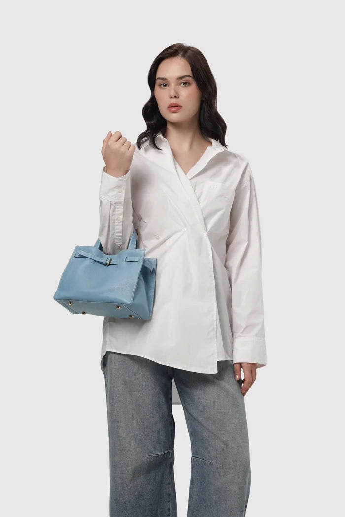 the city bag small in calm by buttonscarves carried on wrist