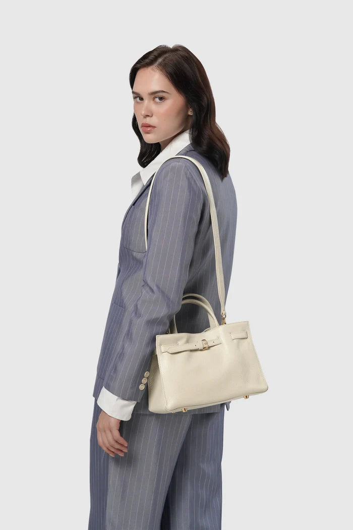 the city bag small in gardenia by buttonscarves carried on shoulder