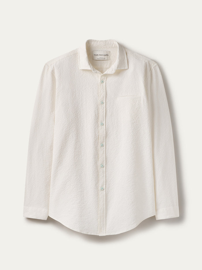 White solid long-sleeve shirt with chest pocket, moisture-wicking, shown flat, front view on light background.
