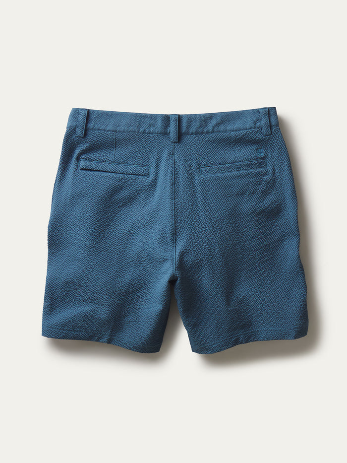 Blue solid shorts with UPF and belt loops, flat lay view on a light background.