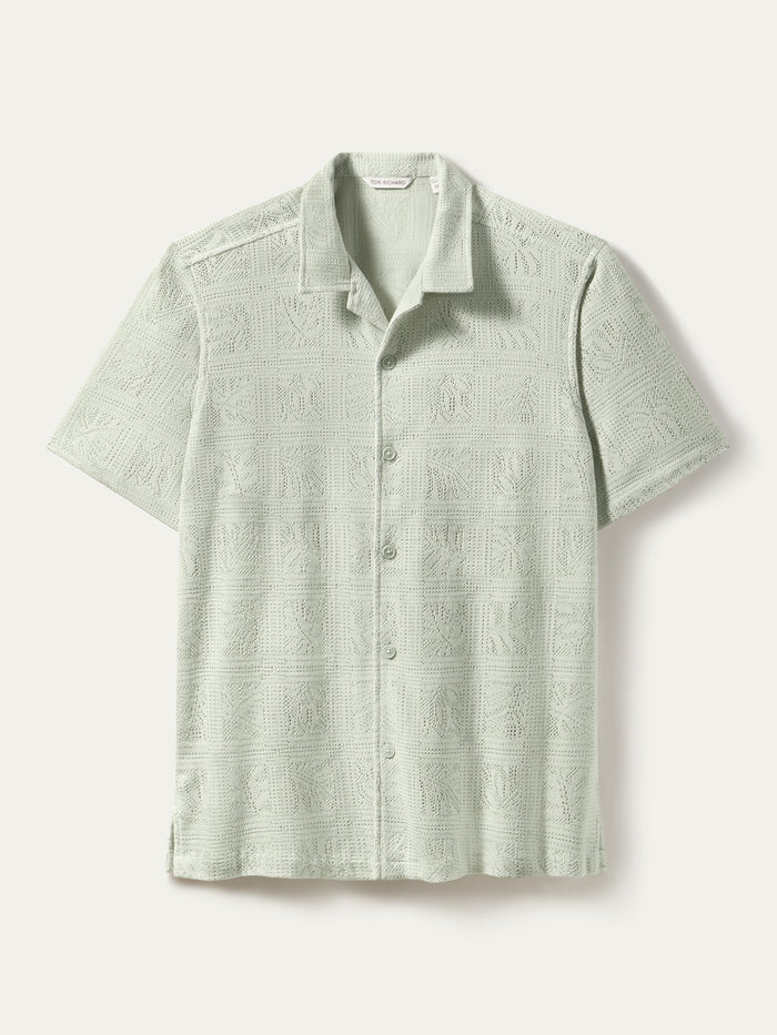 Light green square-textured short-sleeve button-up shirt, front view.