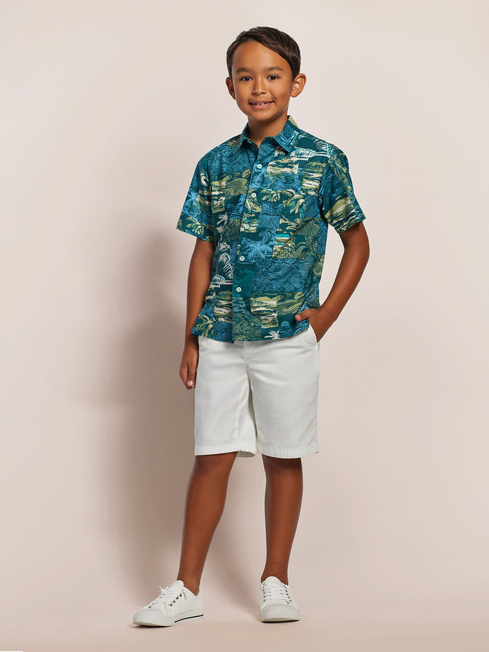 Blue and white tile-print short-sleeve shirt with white shorts, front view, plain background.