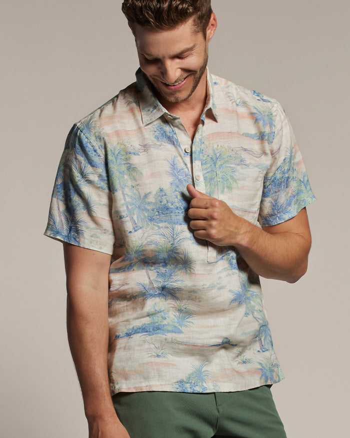 Light blue slub linen long-sleeve half-placket shirt with green pants, front view shown in both images.