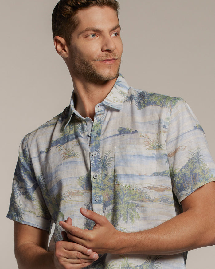 Blue and white color-block half-placket shirt, side view of model looking away.