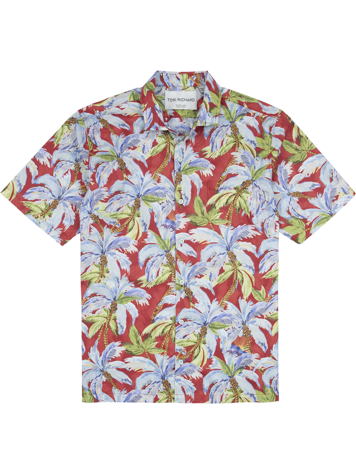 Red short-sleeve shirt with blue, green, and white palm leaf print, front view.