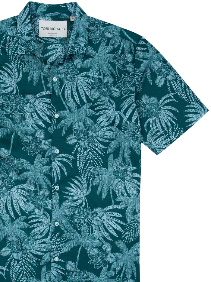 Teal and white tropical floral-print short-sleeve shirt, front view.
