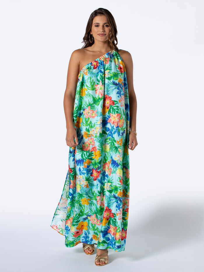 Multicolor tropical-print sleeveless maxi dress with sandals, front view.