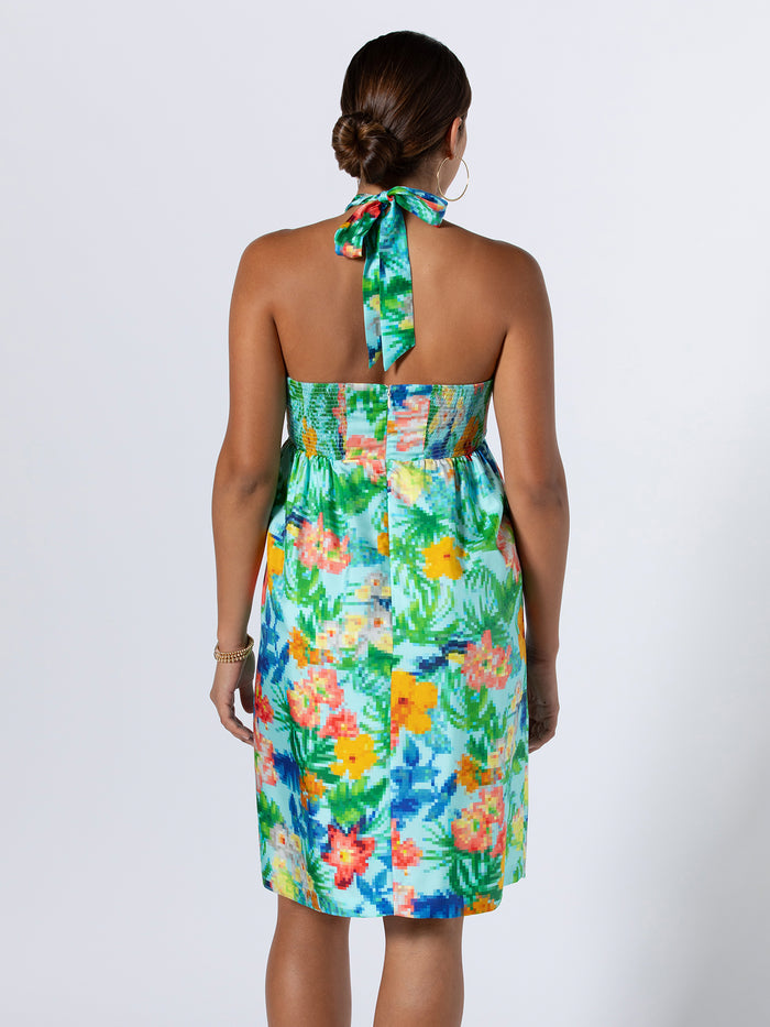 Magenta floral-print silk halter dress with neck bow, back view against plain background.