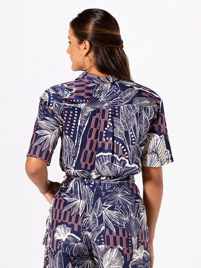 White Urban Oasis Hailie blouse and pants set, back view, woman with long brown hair.