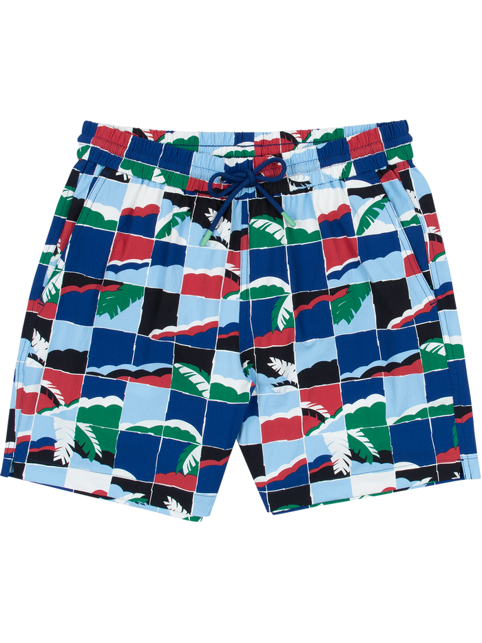 Front and back views of multicolor tropical leaf and geometric-print swim trunks.