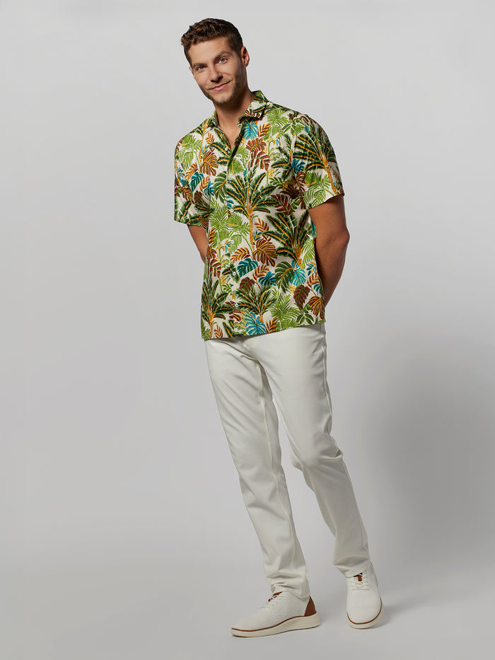 Yellow Voyager-print short-sleeve shirt, white pants and shoes, front view.
