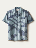 Light blue sand-washed short-sleeve shirt with a wave print, button front, and chest pocket, shown in a front view.