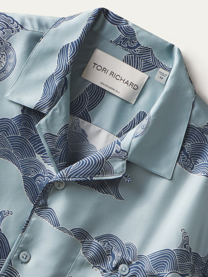 Light blue sand-washed silk shirt with dark blue wave print, button front, shown from front view.