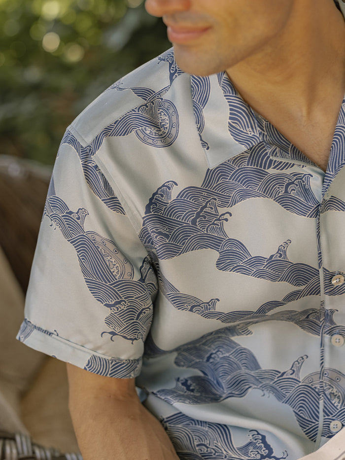 Light Blue Water Wheel patterned sand-washed Mulberry silk shirt, outdoor seated view.