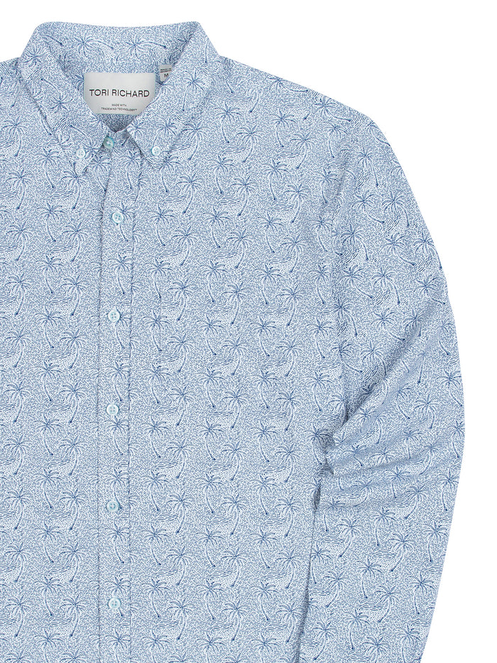 Light blue palm-print long-sleeve shirt with UPF; sleeve shown bent for details.